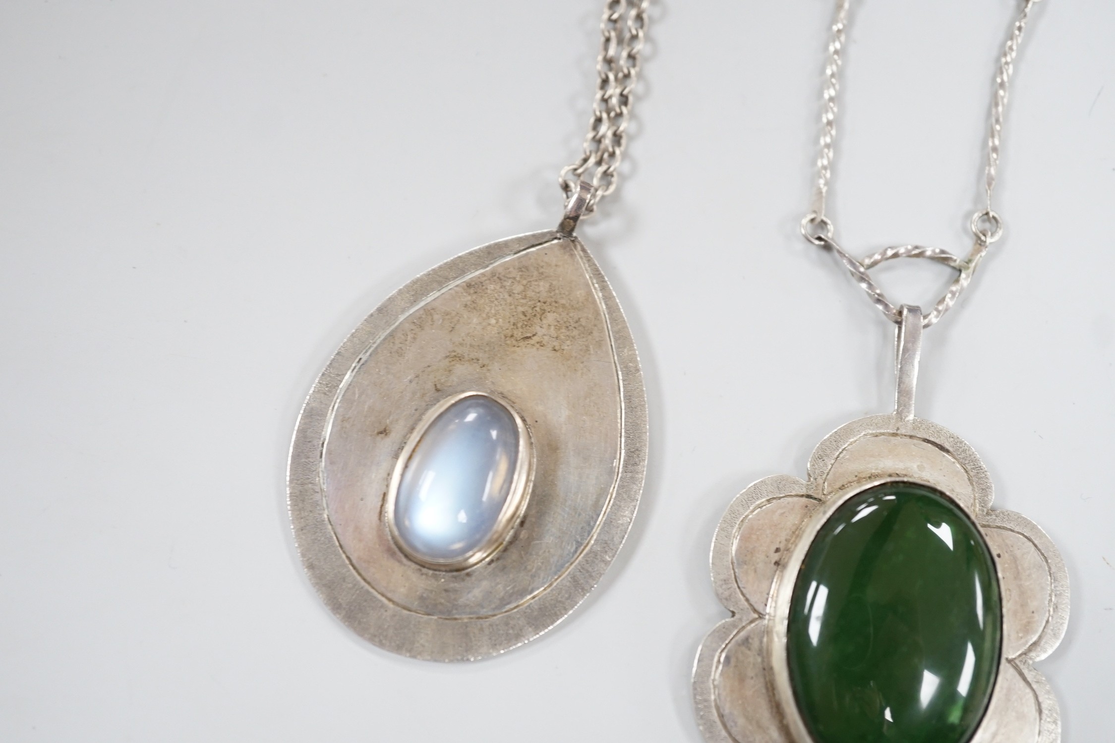 Three modern silver pendants by H.A. Crawshaw? including moonstone set pear shaped pendant, 53mm, all with chains.